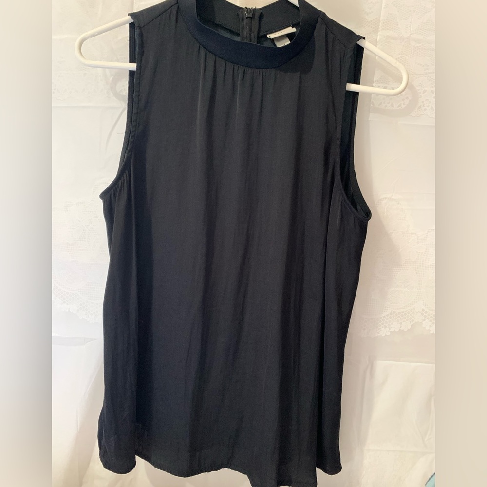 A new Day sleeveless blouse. Amazing under shirt for a blazer